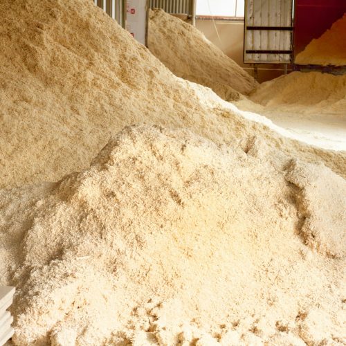 piles-of-sawdust-of-wood-for-the-production-of-fuel-pellets-storage-facilities-for-raw-materials.jpg